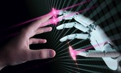 Ihmisen sormet koskettavat robotin sormia